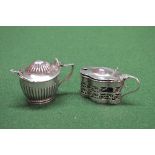 Two silver mustard pots each having blue glass liners, marked for Birmingham and Sheffield