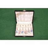 Set of six silver and enamel coffee spoons having floral decoration of handles and bowls, marked for