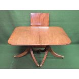 19th century mahogany twin pillar dining table with additional leaf, the top having rounded