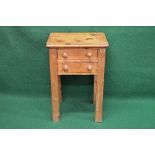 Pine side table having rectangular top over two short drawers with knob handles, standing on