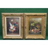 Two late 20th century oil on board still life paintings of fruit and flowers - in unglazed gilt
