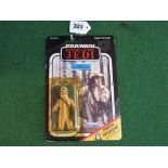 Star Wars Return Of The Jedi Logray (Ewok-Medicine Man) carded figure on a 65 back. Bubble yellow,