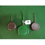 Three Atco circular oil cans - 2.5" and 3.5" in dia Please note descriptions are not condition