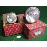 Pair of left and right wing mounted 7" Lucas 700 head lamps with black bowls and chromed rims,