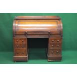 Victorian mahogany cylinder roll top desk opening to reveal fitted interior of pigeon holes, drawers