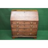 Georgian oak bureau having fall front opening to reveal fitted interior of pigeon holes and