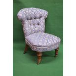 Victorian button back nursing chair having padded back and seat on turned legs and castors Please