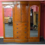 Late 19th century mahogany wardrobe having bow front centre section of two doors over four graduated