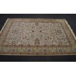 20th century Sultan Hali rug having cream ground with rust, green and black pattern with end tassels