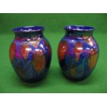 Pair of Poole Pottery Cosmic pattern bulbous vases having blue and red lustre glaze - 9.5" tall