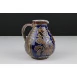 20th century German salt glazed jug decorated with the figure of a cockerel