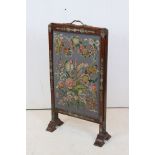 Antique firescreen with brass mounts and two pull-out panels