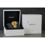 A cased gents Seiko five gold plated gents wristwatch with day & date function.