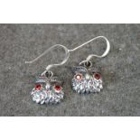 Pair of silver owl earrings with ruby eyes