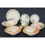 Ten items of Clarice Cliff ceramics including a Grapefruit Bowl, Two Lidded Tureens, Teapot, Milk
