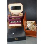 A large collection of vintage and contemporary costume jewellery contained within four boxes.