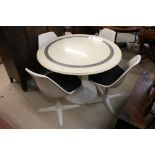 Set of Four Arkana White Swivel Chairs together with an Arkana Tulip Pedestal Table with a