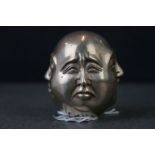 White metal four faced Buddha paperweight, with Chinese character marks to base