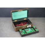 An early 20th century jewellery box together with two cherry amber / bakelite beaded necklaces.