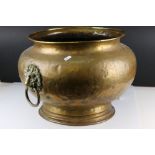 Large Brass Globular Jardiniere / Planter with twin lion mask ringed handles, 33cms high