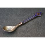 A hallmarked Russian silver and enamel decorative spoon.