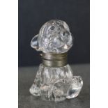 A vintage glass inkwell in the form of Bonzo the dog.