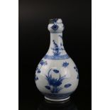 Chinese Blue and White Vase of Baluster form decorated with floral sprays, Kangxi period, 23cms high