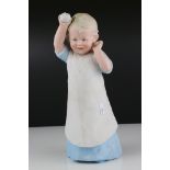 Early 20th century Gebruder Heubach Bisque Figure in the form of a Young Child holding a ball,