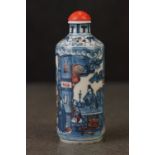 Chinese Porcelain Snuff Bottle and Stopper decorated in blue and iron red depicting figures,