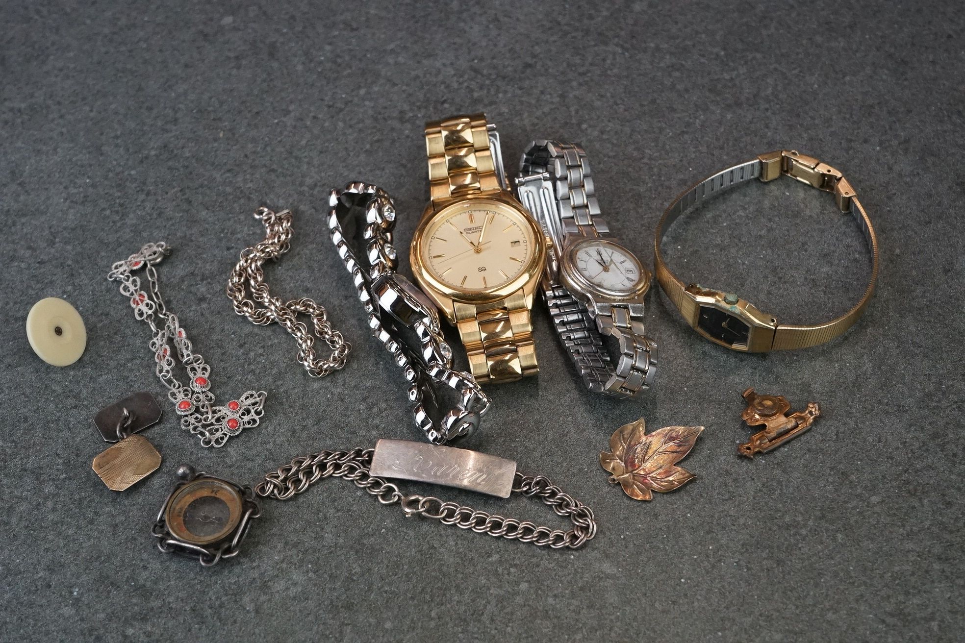 A small group of mixed collectables to include a Seiko SQ gents watch, costume jewellery and a fob