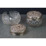 Two antique glass powder jars with fully hallmarked sterling silver lids, one A/F.