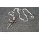 Silver cross necklace with embossed skull decoration