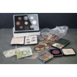 A small collection of mixed coins and banknotes to include an 1897 Morgan Dollar and a small