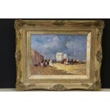 Oil on board, a view of a busy Victorian beach scene with figures and bathing machines