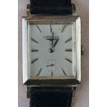 A vintage gents Longines wristwatch with original strap.