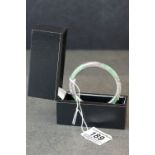 A 925 silver mounted jade bangle.