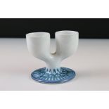 Troika White Glazed Double Egg Cup, the circular base with blue painted pattern, designed by Denis