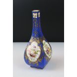 Continental Porcelain Vase, the blue ground with gilt highlights and hand painted panels of