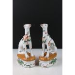 Pair of Contemporary Chinese Greyhounds decorated with Fruits, Insects and Foliage, 21cms high