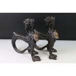 Pair of 19th century Cast Iron and Copper Fire Dogs in the form of Griffins, each stamped with a