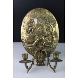 Pair of 19th century Brass Candle Sconces mounted on an Oval Wall Plaque with relief decoration of a