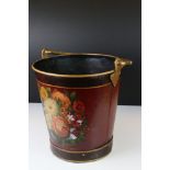 Toleware bucket with floral decoration on a maroon ground