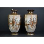 A pair of Japanese satsuma vases with enamel decoration.