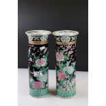 Pair of Chinese Famille Rose Sleeve Vases decorated with flowers on a black ground, painted blue