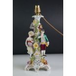 Dresden Porcelain Table Lamp in the form of a man and woman stood on a floral encrusted tree,