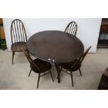 Ercol Dark Elm Top Circular Folding Dining Table, 123cms x 113cms x 71cms high together with Four