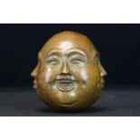 Four faced Buddha paperweight, signed with character marks to underside