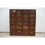 19th century Apothecary style Multi-drawer Cabinet comprising a bank of twenty three drawers with