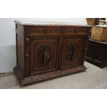 Late 19th century Oak Cupboard / Sideboard, heavily carved with Lion Mask Handles to the two