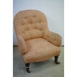 Victorian Button Back Nursing Armchair raised on turned supports with castors, 79cms high x 65cms